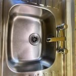 A spotless, professionally cleaned kitchen sink in a Portsmouth property, with gleaming taps, polished drainer, and limescale-free surfaces, ready for the tenancy inspection.